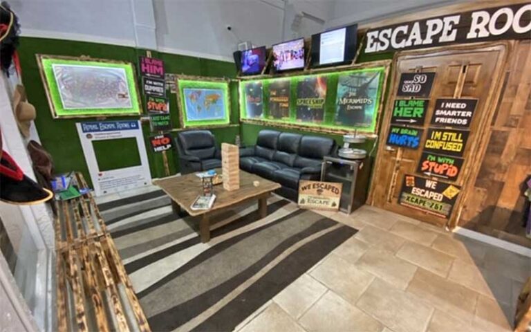 lounge area with room posters at royal escape games panama city beach