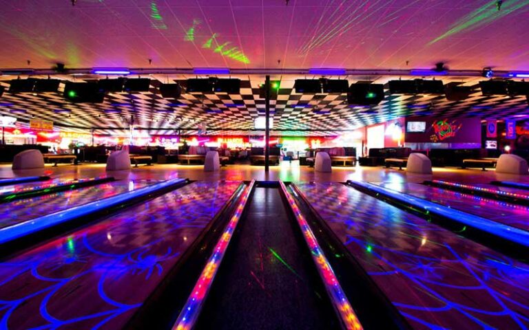 low lighting with neon and blacklight bowling lanes at rockit lanes panama city beach