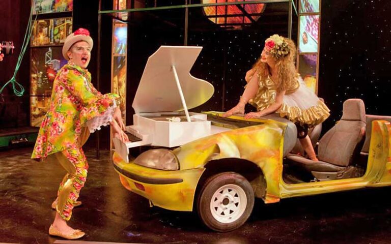 man and woman performing on stage with car prop at hippodrome theatre gainesville