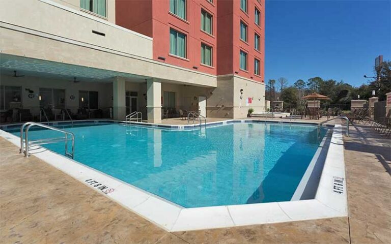 pool deck at base of high rise building at drury inn suites gainesville