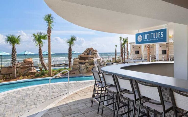 pool deck with bar and waterfalls at springhill suites panama city beach beachfront