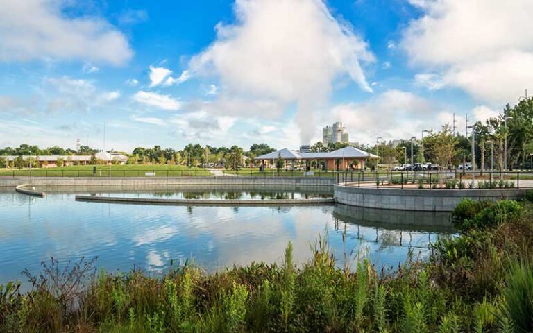 promenade walkway curving around pond at depot park gainesville