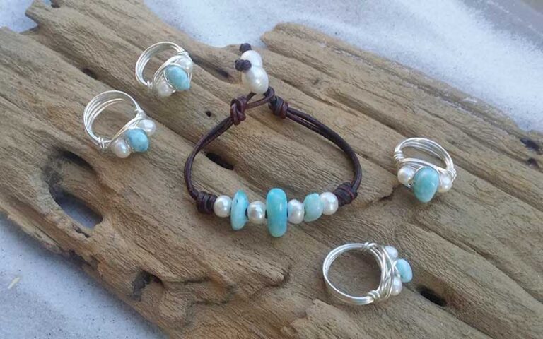 rings and bracelet on wooden display at shimmering seas jewelry gifts panama city beach