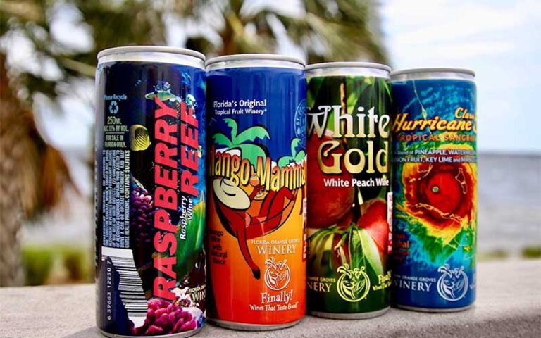 row of cans with beach background at panama city beach winery