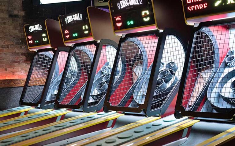 row of skee ball machines at arcade bar gainesville