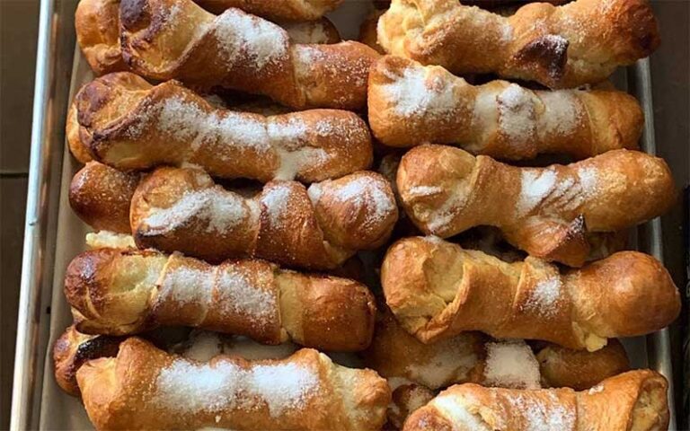 tray of pastelitos with powdered sugar at flacos gainesville