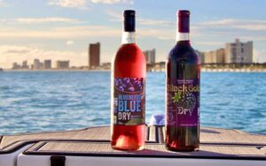 two bottle on boat deck with bay in background at panama city beach winery