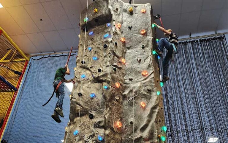 two climbers on rock wall at skate station funworks gainesville