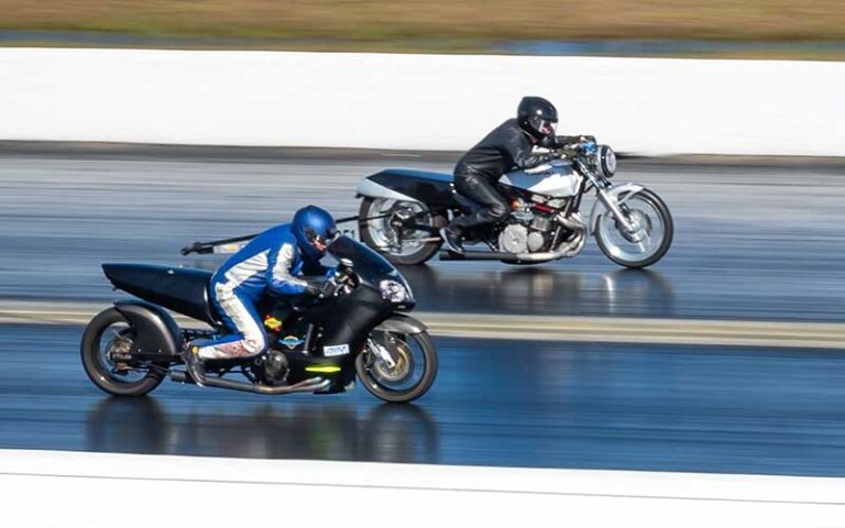 two drag motorcycles competing on track at gainesville raceway