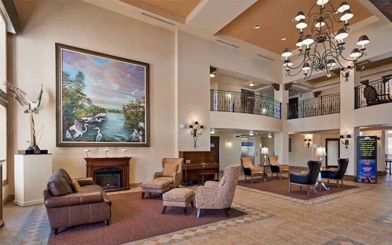 two story lobby with lodge decor at best western gateway grand gainesville