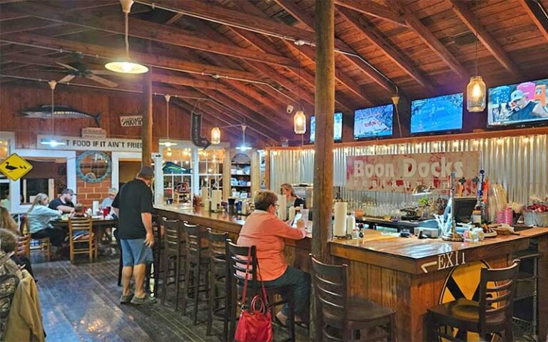 wooden bar inside restaurant at boon docks panama city beach