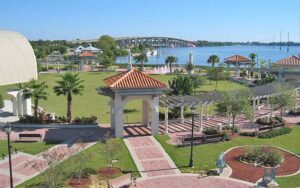 aerial view of park with river and bridge at cocoa riverfront park