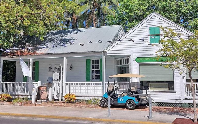 art gallery building with porch and cart at audubon house tropical gardens key west