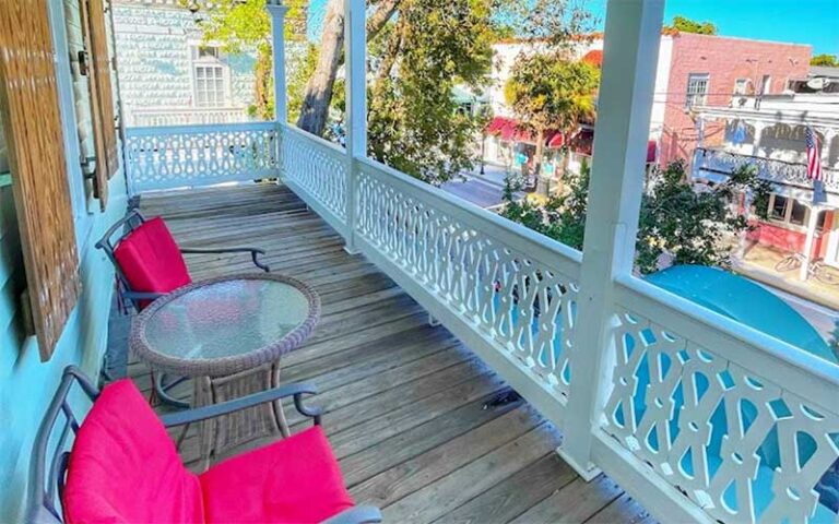 balcony with seating overlooking duval street at casablanca hotel key west