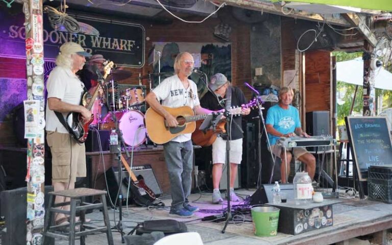 band performing on stage in dining courtyard at schooners wharf bar key west