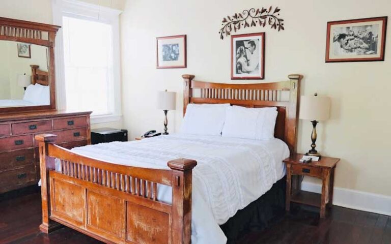 bedroom suite with wooden furniture at casablanca hotel key west