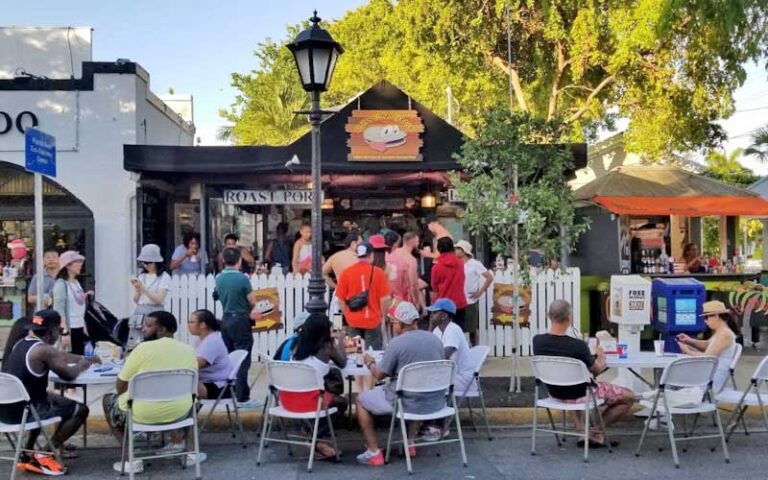 bustling cafe with overflowing sidewalk tables at djs clam shack key west