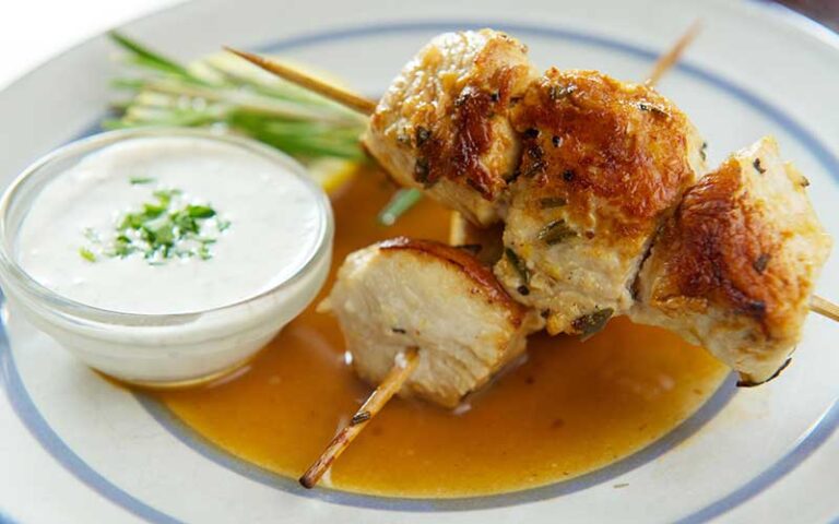 chicken skewers with white dip at santiagos bodega key west