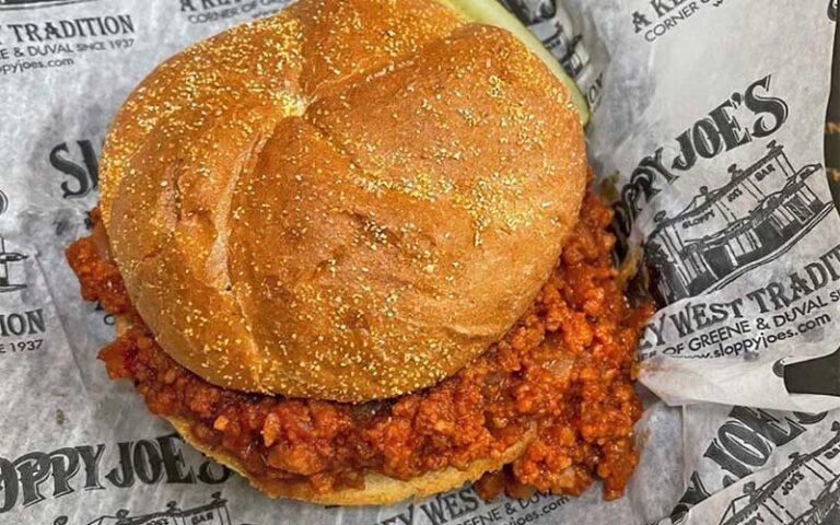 close up of sloppy joe sandwich with pickle at sloppy joes bar key west