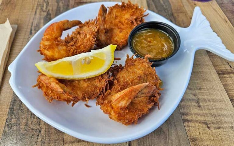 coconut shrimp with sauce on fish plate at rustys seafood oyster bar cape canaveral