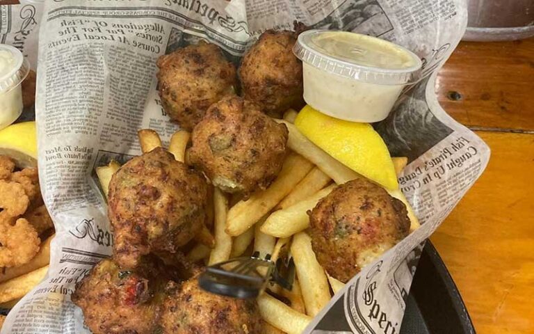 conch fritters entree in newspaper at djs clam shack key west