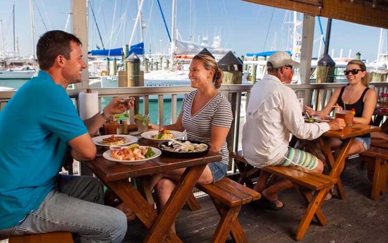 couples at tables in outside patio with ships at half shell raw bar key west