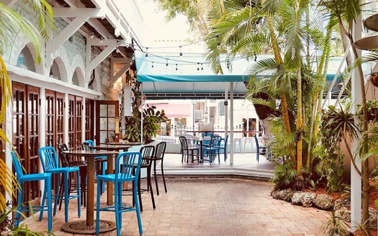 courtyard space with seating and string lights at casablanca hotel key west