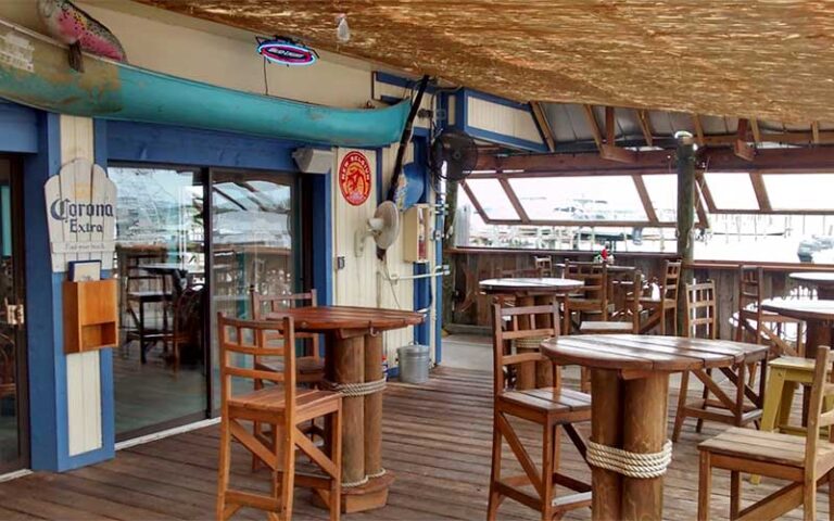 covered outdoor patio with restaurant entrance at the old fish house bar grill grant valkaria