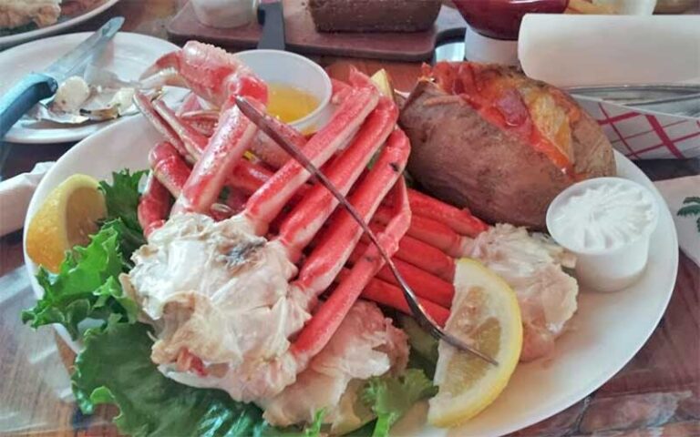 crab legs platter with baked potato at two friends patio restaurant key west