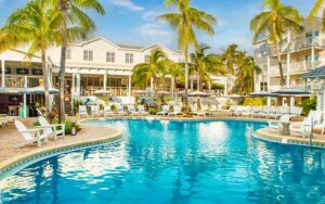 curvy pool with palms and hotel at margaritaville beach house key west