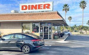 daytime exterior of restaurant with parking at sunrise diner cocoa beach