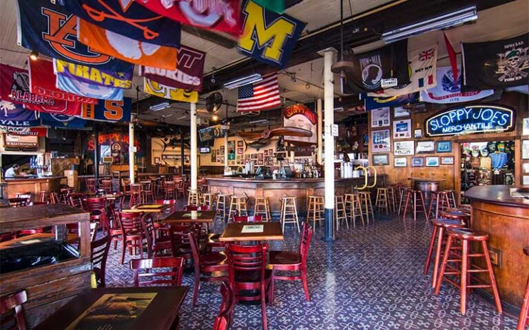 dining room interior with college team flags at sloppy joes bar key west