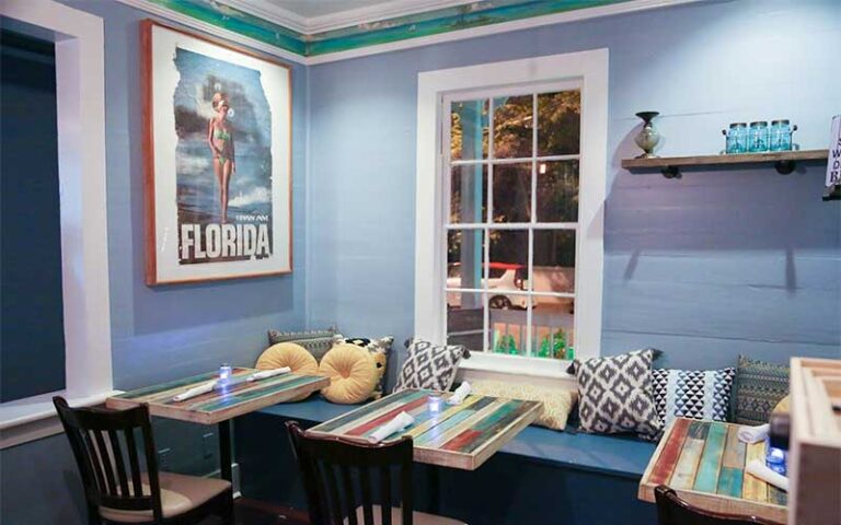 dining room interior with seating at first flight island restaurant brewery key west