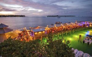 dock restaurant with string lights and night sky at sunset pier key west