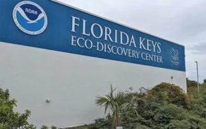 exterior of building with trees and sign at florida keys eco discovery center key west