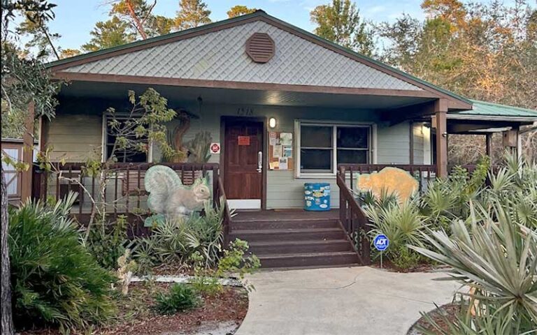 exterior of cabin style visitor center at turkey creek sanctuary palm bay