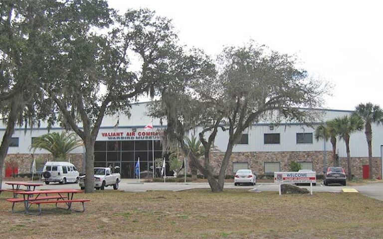 exterior of hangar style building with trees at valiant air command warbird museum space coast