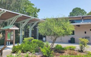 exterior of nature center with signs and entrance at brevard county enchanted forest sanctuary titusville