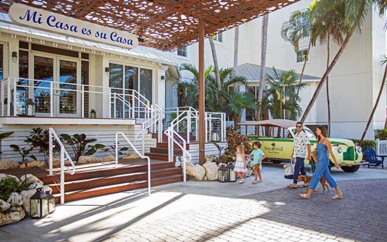 family walking toward entrance steps at margaritaville beach house key west