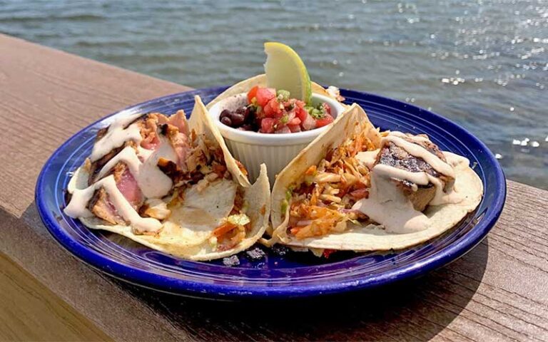 fish tacos with salsa on plate outside patio at grills riverside seafood deck tiki bar melbourne