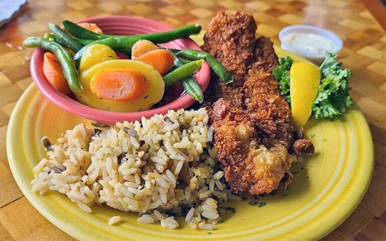 fried fish with sides on yellow plate at squid lips melbourne