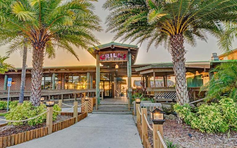 front entrance of restaurant with twilight sky at grills riverside seafood deck tiki bar melbourne