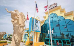 front exterior of large store with surfing man sculpture at ron jon surf shop cocoa beach