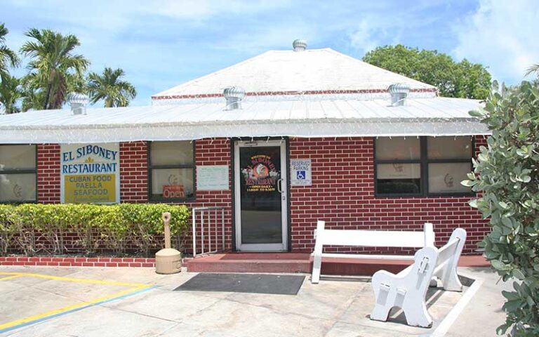 front exterior of red brick diner with white roof at el siboney restaurant key west