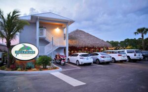 front exterior of restaurant with sign and parking at dolphins waterfront bar grill at cape crossing merritt island