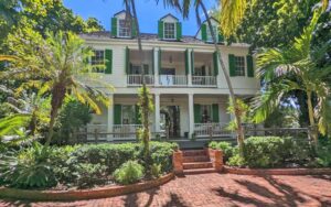 front exterior of three story victorian home at audubon house tropical gardens key west