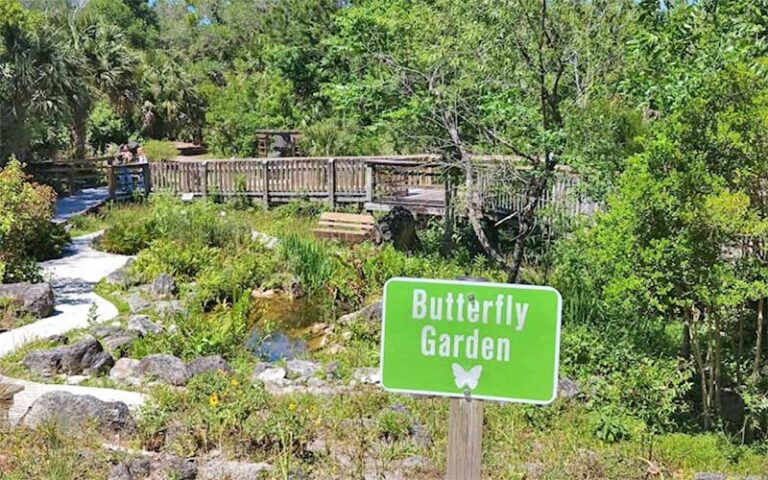 garden area with trails and butterfly garden sign at brevard county enchanted forest sanctuary titusville