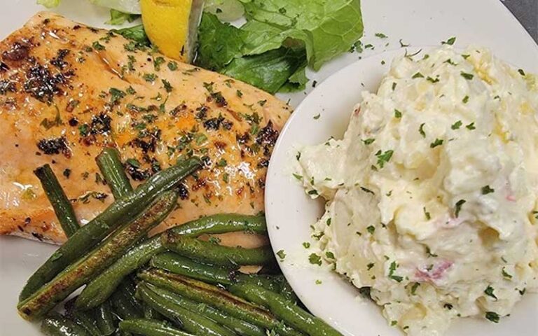 herb crusted fish with sides at sunrise diner cocoa beach