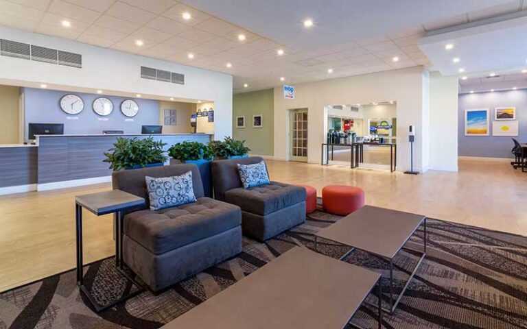 hotel lobby with clocks at days inn by wyndham titusville kennedy space center