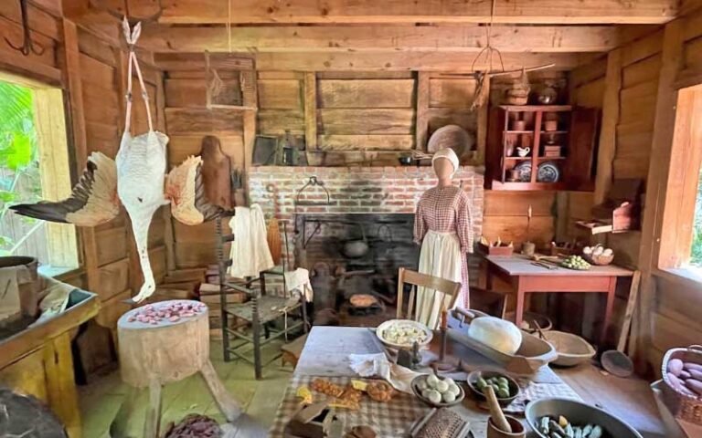 interior of period kitchen with cooking implements and oven at audubon house tropical gardens key west